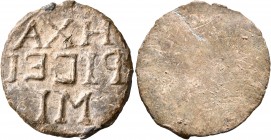 UNCERTAIN. Amulet (Lead, 30 mm, 10.31 g), Votive mirror insert, 2nd-4th ce ntury. H XA/PI C EI/MI ('I am the gratitude') in three lines. Rev. Blank. G...