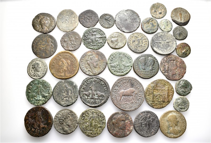 A lot containing 36 bronze coins. All: Roman Provincial. Fine to about very fine...