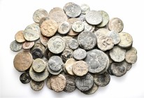 A lot containing 84 bronze coins. All: Roman Provincial. Fine to very fine. LOT SOLD AS IS, NO RETURNS. 84 coins in lot.