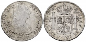 Carlos IV (1788-1808). 8 reales. 1797. México. FM. (Cal-960). Ag. 26,82 g. Golpes en reverso. Alabeada. MBC-. Est...35,00.