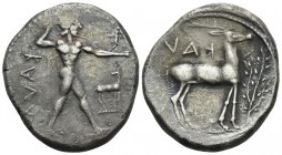 BRUTTIUM. Kaulonia. Circa 475-425 BC. Stater (Silver, 23 mm, 7.72 g, 6 h). ΚΑVΛ Apollo, nude, his hair bound with a taenia, advancing to right, with a...