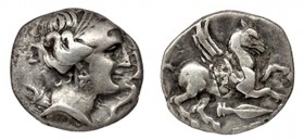 EMPORION. Dracma (principios del s. II a.C.). A/ Cabeza femenina a der., rodeada por tres delfines. R/ Pegaso con cabeza modificada a der., debajo pun...