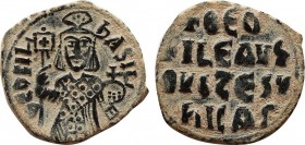 THEOPHILUS (829-842). Half Follis. Constantinople. Obv: ΘЄOFI ЬASIL. Facing bust, holding labarum and globus cruciger, and wearing crown surmounted by...