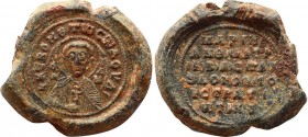 BYZANTINE LEAD SEALS. Marianos, patrikios and strategos (8th century).
Obv: saint bust, in bishop outfit. eco writing pray, holding the cross with his...