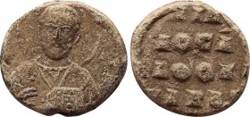 BYZANTINE LEAD SEAL.
Obv: Nimbate bust of saint.
Rev: Legend in 4 lines.
.
Condition: Very fine.
Weight: 7.71 g.
Diameter: 21 mm.