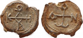 BYZANTINE LEAD SEALS. Uncertain (Circa 7th century).
Obv: Cruciform monogram.
Rev: Cruciform monogram.
.
Condition: Very fine.
Weight: 10.12 g.
Diamet...