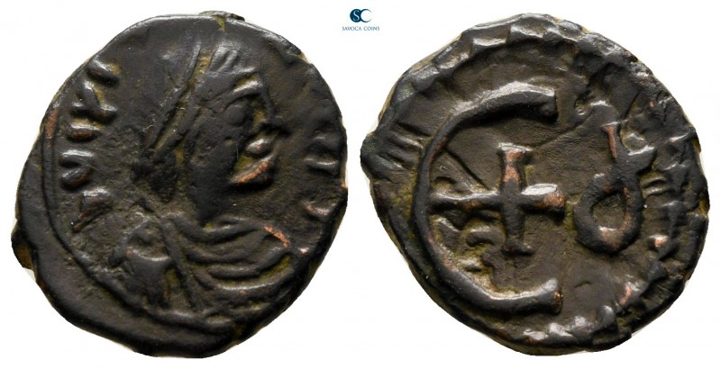 Justinian I AD 527-565. Theoupolis (Antioch)
Pentanummium Æ

15 mm., 2,02 g....