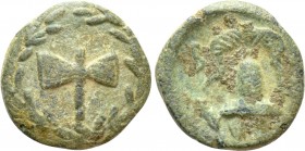 KINGS OF MACEDON. Uncertain. Ae (4th century BC). 

Obv: Labrys within wreath.
Rev: B - A. 
Helmet.

Unpublished in the standard references. 
...
