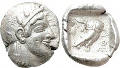 ATTICA. Athens. Tetradrachm (Circa 470-465 BC). Transitional issue. 

Obv: Helmeted head of Athena right, with frontal eye.
Rev: AΘE. 
Owl standin...