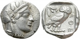 ATTICA. Athens. Tetradrachm (Circa 454-404 BC). 

Obv: Helmeted head of Athena right, with frontal eye.
Rev: AΘE. 
Owl standing right, head facing...