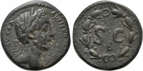 SELEUCIS & PIERIA. Antioch. Commodus (177-192). Ae. 

Obv: ΑΥΤΟΚ[. ] ΑΥPH ΚΟΜΟΔΟΝ. 
Laureate head right.
Rev: S C. 
Inscription within wreath; nu...