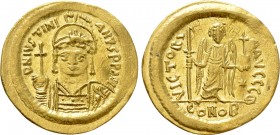 JUSTINIAN I (527-565). GOLD Solidus. Constantinople. 

Obv: D N IVSTINIANVS P P AVG. 
Helmeted and cuirassed bust facing, holding globus cruciger a...