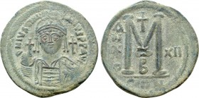 JUSTINIAN I (527-565). Follis. Constantinople. Dated RY 12 (538/9). 

Obv: D N IVSTINIANVS P P AVG. 
Helmeted and cuirassed bust facing, holding gl...