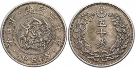 Japan 50 Sen 1897 
Y# 25; Yr. 30; Silver 13,46g.; A beautiful specimen with an old smooth patina and stamp sheen; AU