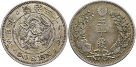 Japan 50 Sen 1898 
Y# 25; Yr. 31; Silver 13,53g.; A beautiful specimen with an old smooth patina and stamp sheen; AU
