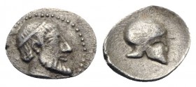 Sicily, Himera, c. 470-450 BC. AR Litra (8.5mm, 0.42g, 6h). Bearded head r., wearing tainia. R/ Helmet. HGC 2, 448; SNG Lloyd 1028. Rare, Good VF