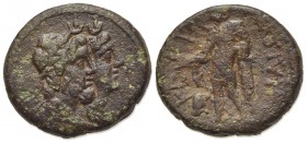 Sicily, Katane, late 3rd century BC. Æ (18mm, 5.28g, 12h). Jugate busts of Serapis and Isis; grain-ear behind. R/ Apollo standing slightly l., leaning...