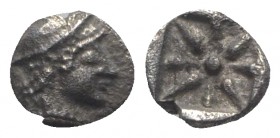 Asia Minor, Uncertain, c. 5th century BC. AR Hemiobol (5.5mm, 0.36g). Helmeted head r. R/ Eight-rayed star. Unpublished in the standard references. VF