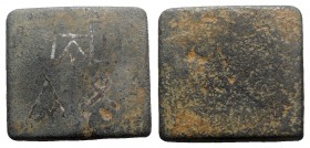Byzantine Æ Ounce Square Commercial Weight, 5th-7th centuries AD (25mm, 26.32g). Three monograms. R/ Blank. VF