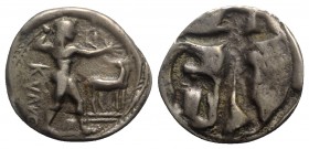 Bruttium, Kaulonia, c. 525-500 BC. Fake AR Stater (24mm, 7.36g, 12h). Apollo advancing r., holding branch; small daimon running r. on Apollo's l. arm;...