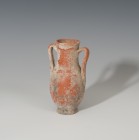 ROMA. Imperio Romano. Jarra (I-II d.C.). Terra sigillata. Con dos asas. Altura 13,8 cm. Diámetro 4,1 cm.