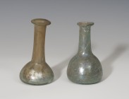 ROMA. Imperio Romano. Lote de dos ungüentarios (I-II d.C.). Vidrio. Uno con depósito troncocónico y cuello alto y otro con depósito semiglobular achat...