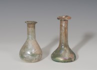 ROMA. Imperio Romano. Lote de dos ungüentarios (I-II d.C.). Vidrio. Uno tubular con depósito troncocónico achatado y otro con depósito troncocónico y ...