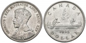 CANADA. 1 USD (Ar. 23.28g \/ 36mm). 1935. 25th Anniversary of the Reign of Jorge V. (Km # 30). XF. Limited.