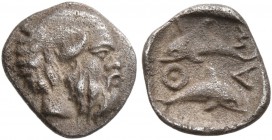 ISLANDS OFF THRACE, Thasos. Circa 411-340 BC. Hemiobol (Silver, 8 mm, 0.37 g, 2 h). Head of bald and bearded satyr to right. Rev. Θ-Α-Σ-I Two dolphins...