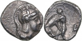 Calabria - Tarentum AR Diobol - (circa 325-280 BC)
1.06 g. 11mm. VF/VF Head of Athena right, wearing helmet decorated with Skylla./ Heracles kneeling...