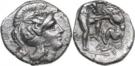 Calabria - Tarentum AR Diobol - (circa 325-280 BC)
1.05 g. 12mm. VF/VF Head of Athena right, wearing helmet decorated with Skylla./ Heracles kneeling...