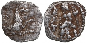 Lykaonia - Laranda AR Obol (circa 324/3 BC)
0.49 g. 13mm. VF/VF Baaltars seated left, holding grain ear, grape bunch, and sceptre. / Forepart of wolf...