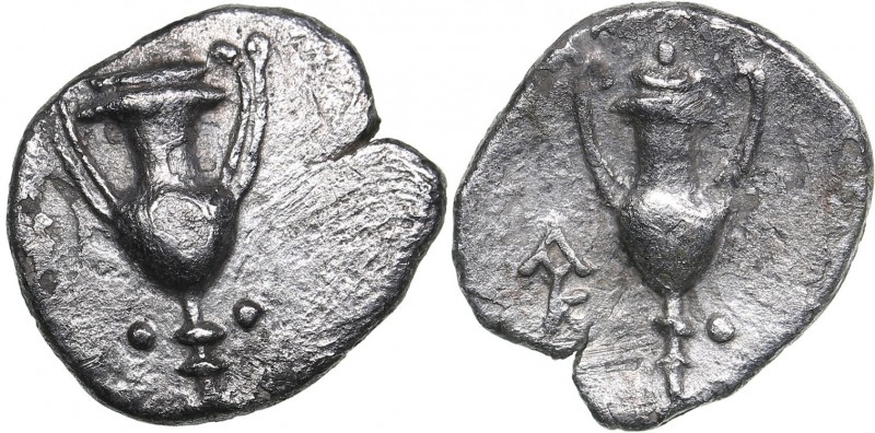 Calabria - Tarentum AR Obol (circa 280-228 BC)
0.41 g. 10mm. VF/VF Kantharos wi...