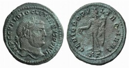 Diocletian (284-305). Æ Follis (27mm, 8.22g, 7h). Cyzicus, 295-6. Laureate head r. R/ Genius standing l., holding patera and cornucopiae; KΓ. RIC VI 1...