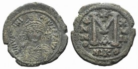 Justinian I (527-565). Æ 40 Nummi (33mm, 20.03g, 6h). Nicomedia, year 17 (543/4). Helmeted and cuirassed facing bust, holding globus cruciger and shie...
