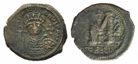 Justinian I (527-565). Æ 40 Nummi (35mm, 17.94g, 6h). Theoupolis (Antioch), year 34 (560/1). Helmeted and cuirassed bust facing, holding globus crucig...