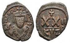 Phocas (602-610). Æ 20 Nummi (22mm, 4.81g, 6h). Cyzicus, year 2 (603/4). Crowned facing bust, wearing consular robes, holding mappa and cross / Large ...