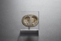 Silver intaglio inset for an open bezel. Roman, 3 cent. AD (6.6g). Depicting two confronted heads (Marcus Aurelius and Commodus ?). Around, Greek insc...