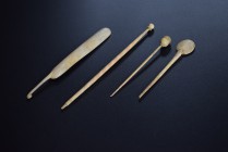 Lot of 4 bone instruments, including two needles, a spoon and a spatula. 2nd-3rd cent. AD. All intact