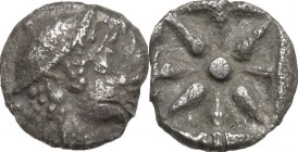 Greek Asia. Asia Minor, uncertain mint. AR Hemiobol, c. 5th century BC. Helmeted head right. / Eight-rayed star. Unpublished in the standard reference...