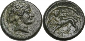 Greek Asia. Lydia, Sardes. AE 16 mm. 2nd-1st century BC. Head of Dionysos right, wearing ivy wreath. / Horned panther standing left, head facing, brea...