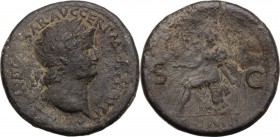 Nero (54-68). AE Sestertius, c. 65 AD. Laureate head right. / Roma helmeted and in military dress, seated left on cuirass, holding Victory and left re...