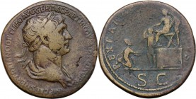 Trajan (98-117). AE Sestertius, Struck 20 February 116-August 117 AD. Laureate and draped bust right. / Trajan seated left on platform, presenting Par...