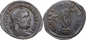 Galerius (305-311). Follis, 308-310 AD. Nicomedia mint. Laureate head right. / Genius standing facing, nude, head left, holding patera and cornucopia....