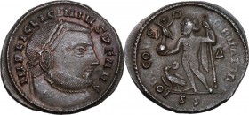 Licinius I (308-324). AE Follis, 313-315 AD. Siscia mint. Head right, laureate. / Jupiter standing left, holding Victory on globe and scepter; to feet...
