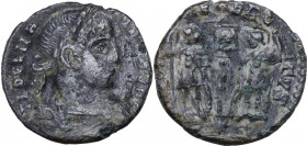 Delmatius (335-337). AE 15 mm, Siscia mint. Bust right, laureate, draped, cuirassed. / Two soldiers standing facing each other, holding in outer hand ...