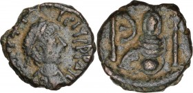 Justinian I (527-565). AE Pentanummium. Theoupolis (Antioch) mint. Laureate, draped, and cuirassed bust right. / Tyche of Antioch seated right within ...