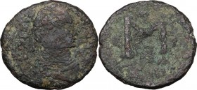 Justinian I (527-565). AE Follis. Rome mint. Struck 537-542. Diademed, draped, and cuirassed bust right. / Large M; cross above and to right, star to ...