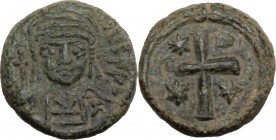 Justinian I (527-565). AE Decanummium, 547-552, Ravenna mint. Bust facing, helmeted, draped, cuirassed. / Cross; in the angles, stars; all in wreath. ...