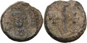 Tiberius II Constantine (578-582). AE Decanummium. Ravenna mint. Helmeted and cuirassed bust facing, holding globus cruciger and shield. / Large I bet...